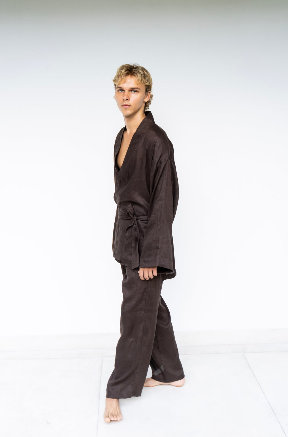 A man model wearing a dark brown Shen pant