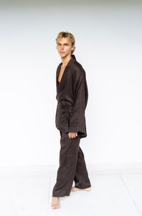 A man model wearing a dark brown Shen pant
